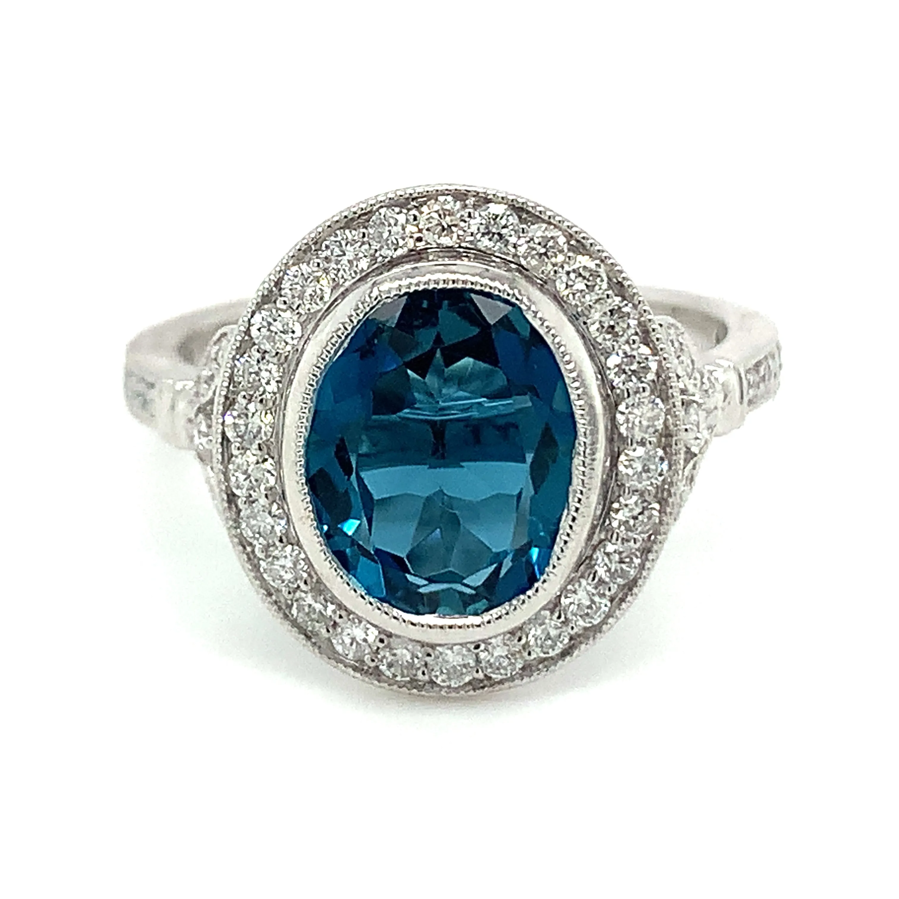 9ct White Gold Earth Grown Oval Cut 2.811ct London Blue Topaz & Diamond Halo Ring