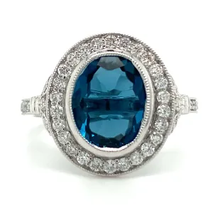 9ct White Gold Earth Grown Oval Cut 2.811ct London Blue Topaz & Diamond Halo Ring