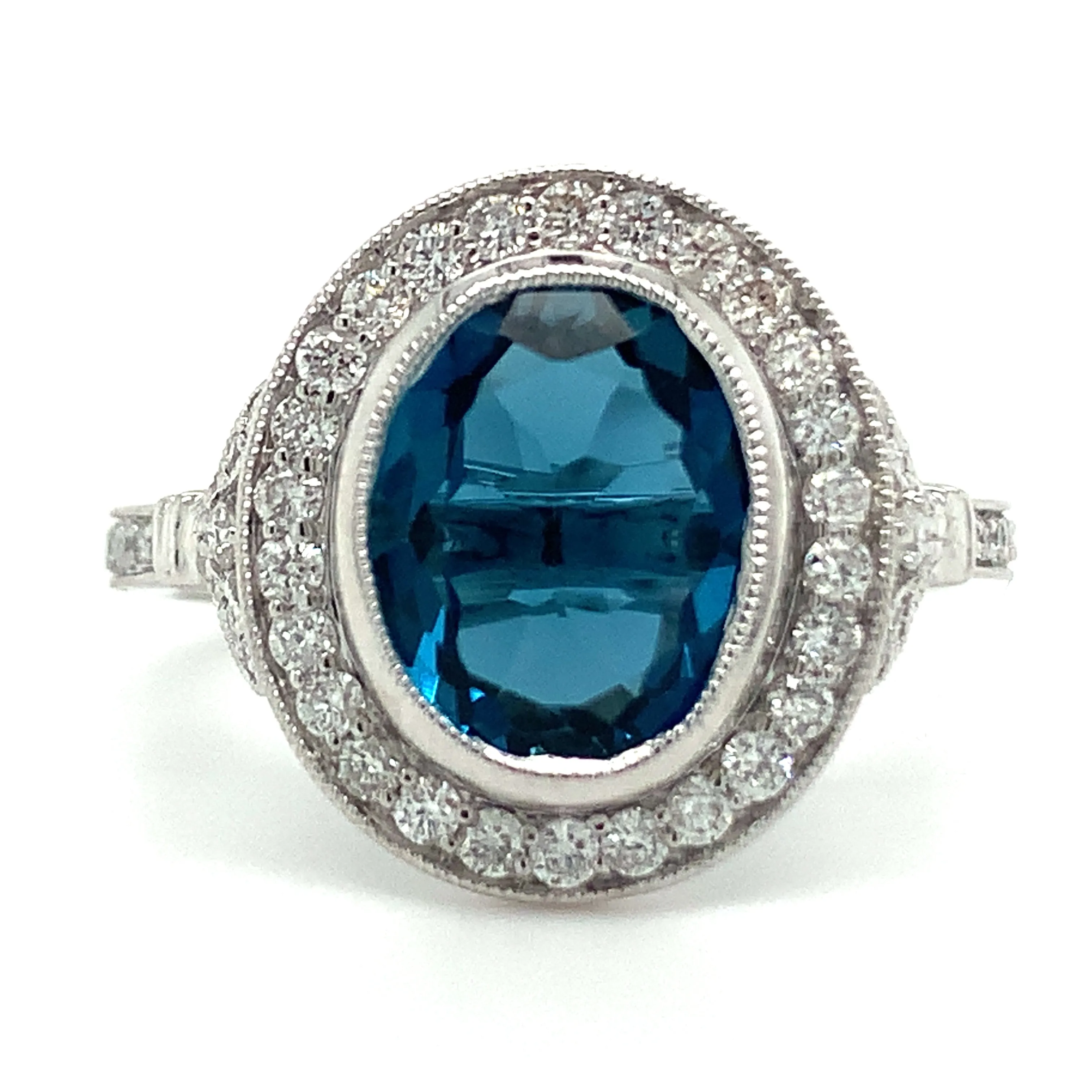 9ct White Gold Earth Grown Oval Cut 2.811ct London Blue Topaz & Diamond Halo Ring