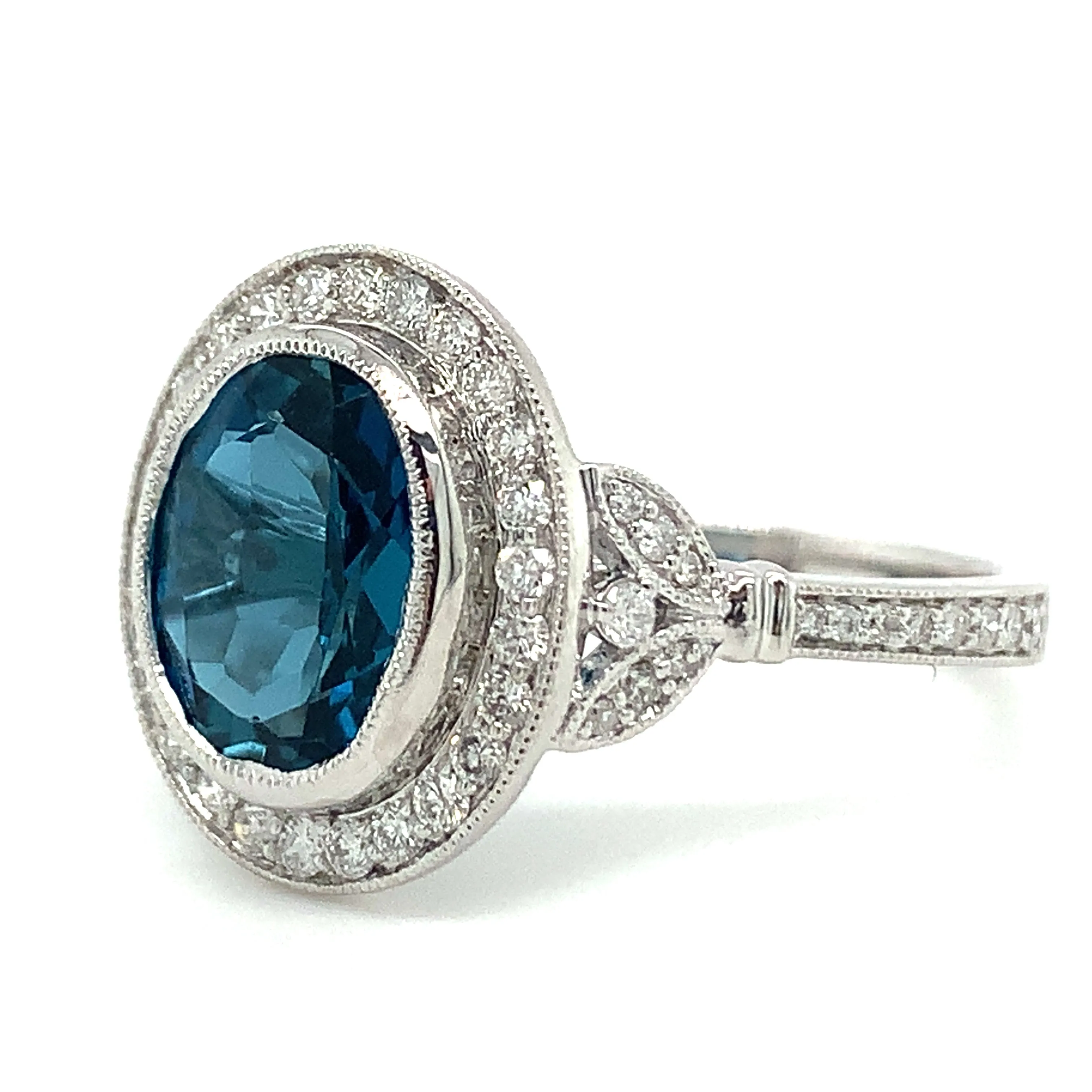 9ct White Gold Earth Grown Oval Cut 2.811ct London Blue Topaz & Diamond Halo Ring